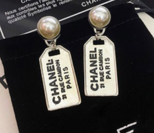 Luggage tag earrings