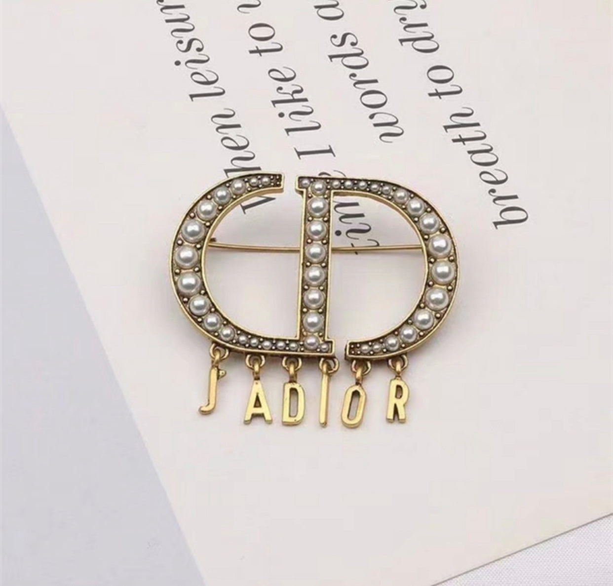 D.I.O.R brooch